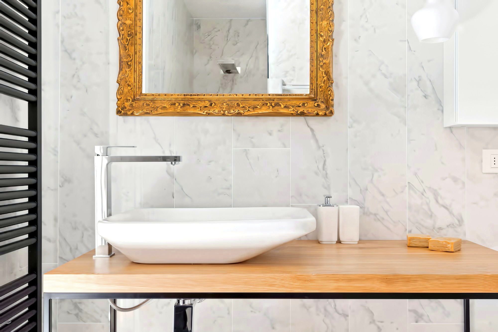 Dimora San Lorenzo marble bathroom with gold mirror